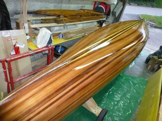 Hull coated with glass webbing and Epoxy